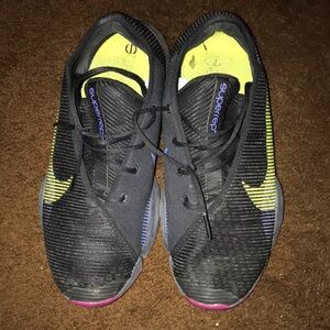 Nike Black and Yellow Athletic Shoes with Mesh Upper